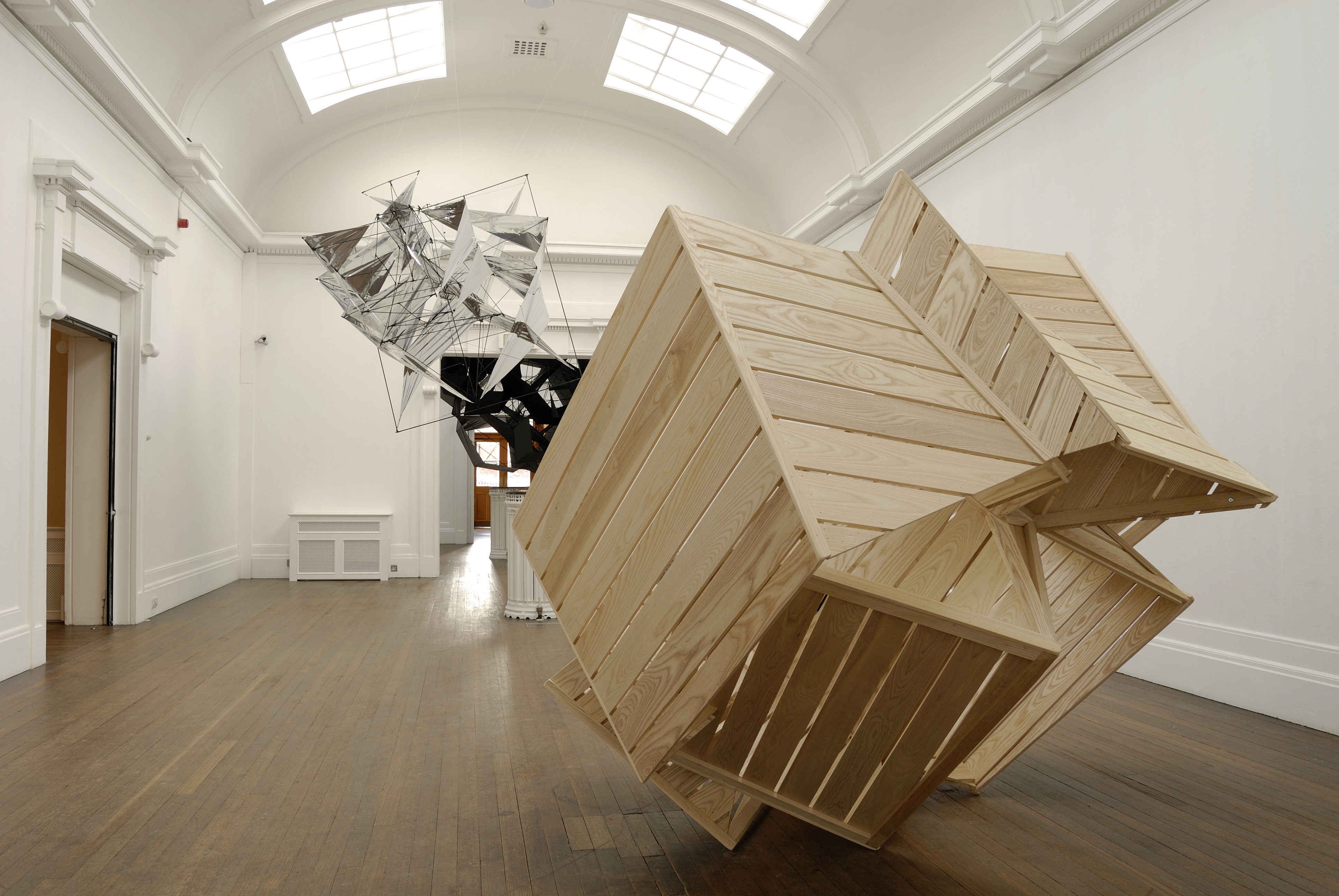 Wooden shed and kite made from silver material. Included in the exhibition Heather And Ivan Morison: The Opposite Of All Those Things