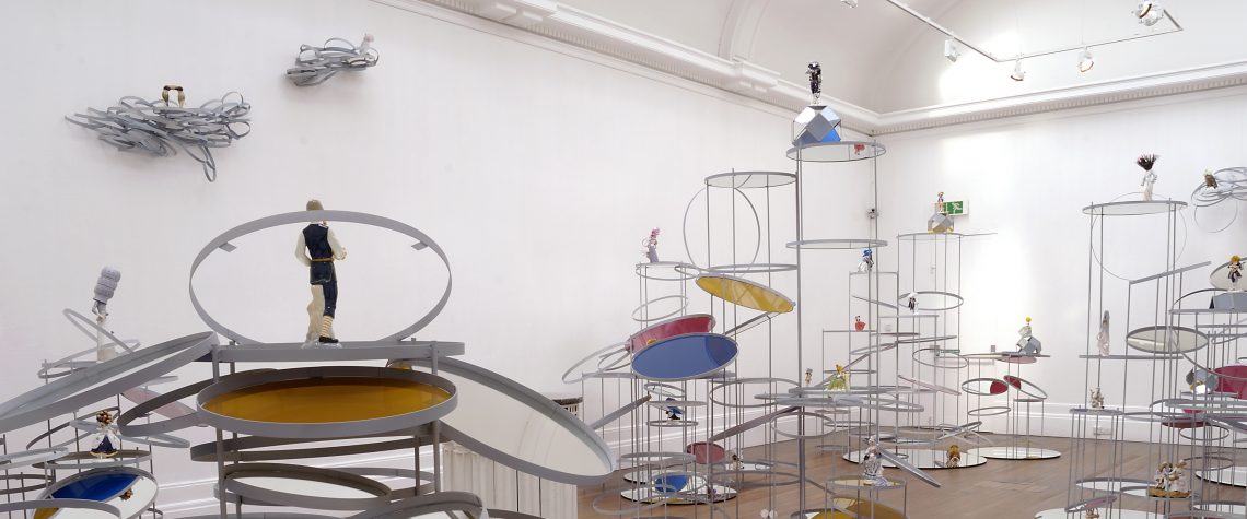 Series of sculptures made in metal and mirror, various altered china figurines. The sculptures were created by artist Ruth Claxton. The works were included in the exhibition Lands End