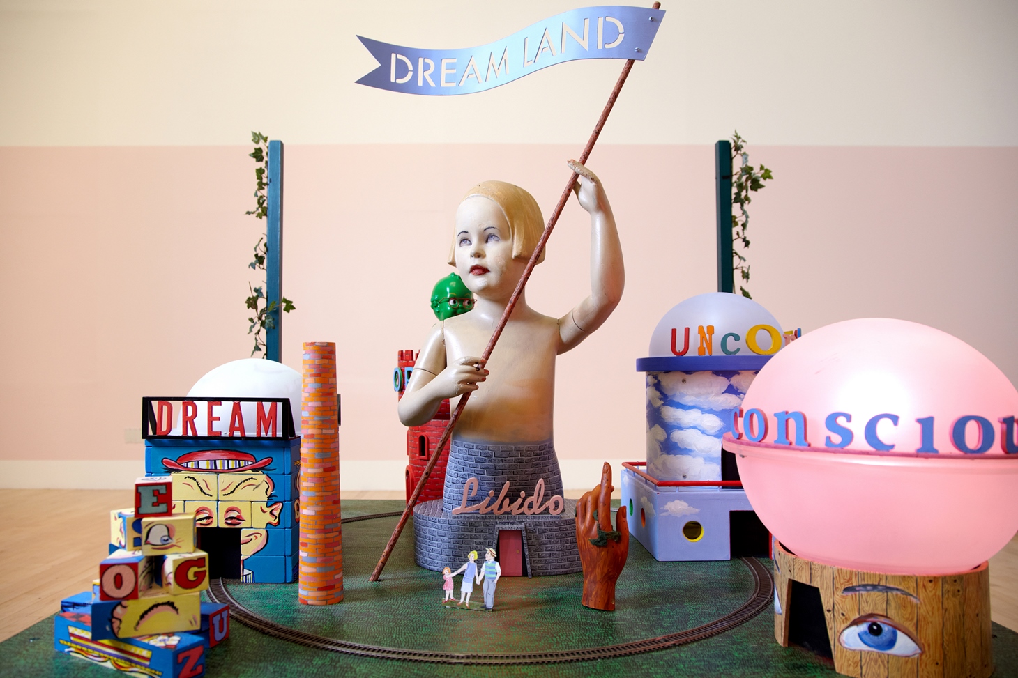 Poster for the exhibition, Zoe Beloff: Dreamland, The Coney Island Amateur Psychoanalytic Society And The Blackpool Chapter. The poster features a model of a fairground ride that would take the rider through the various states of the unconscious as described by Freudian analysis, the poster was created by Talbot Rice.