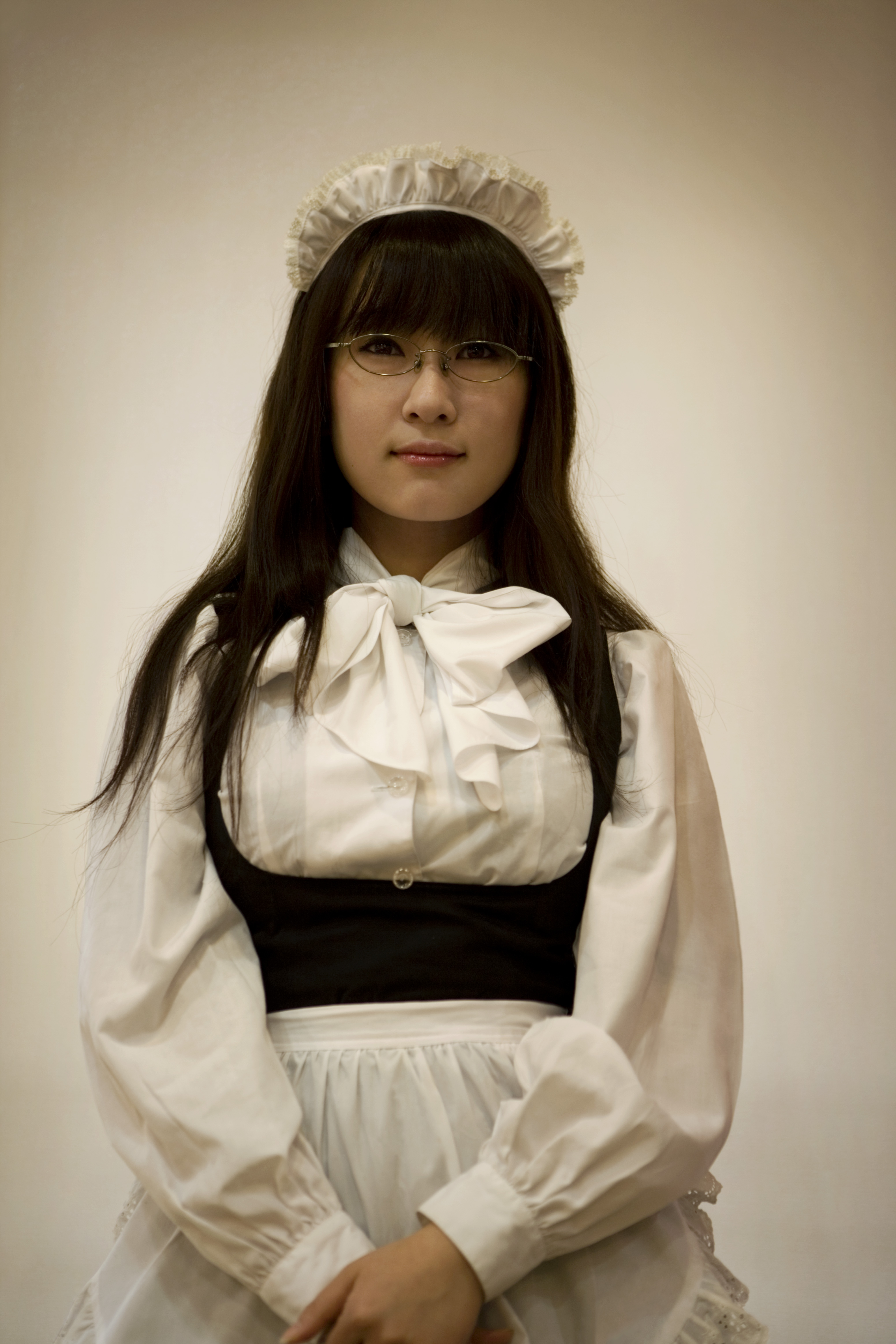Female figure in traditional Japanese maids uniform. The photograph was included in the exhibition Alice Hawkins: All The World is A Stage.
