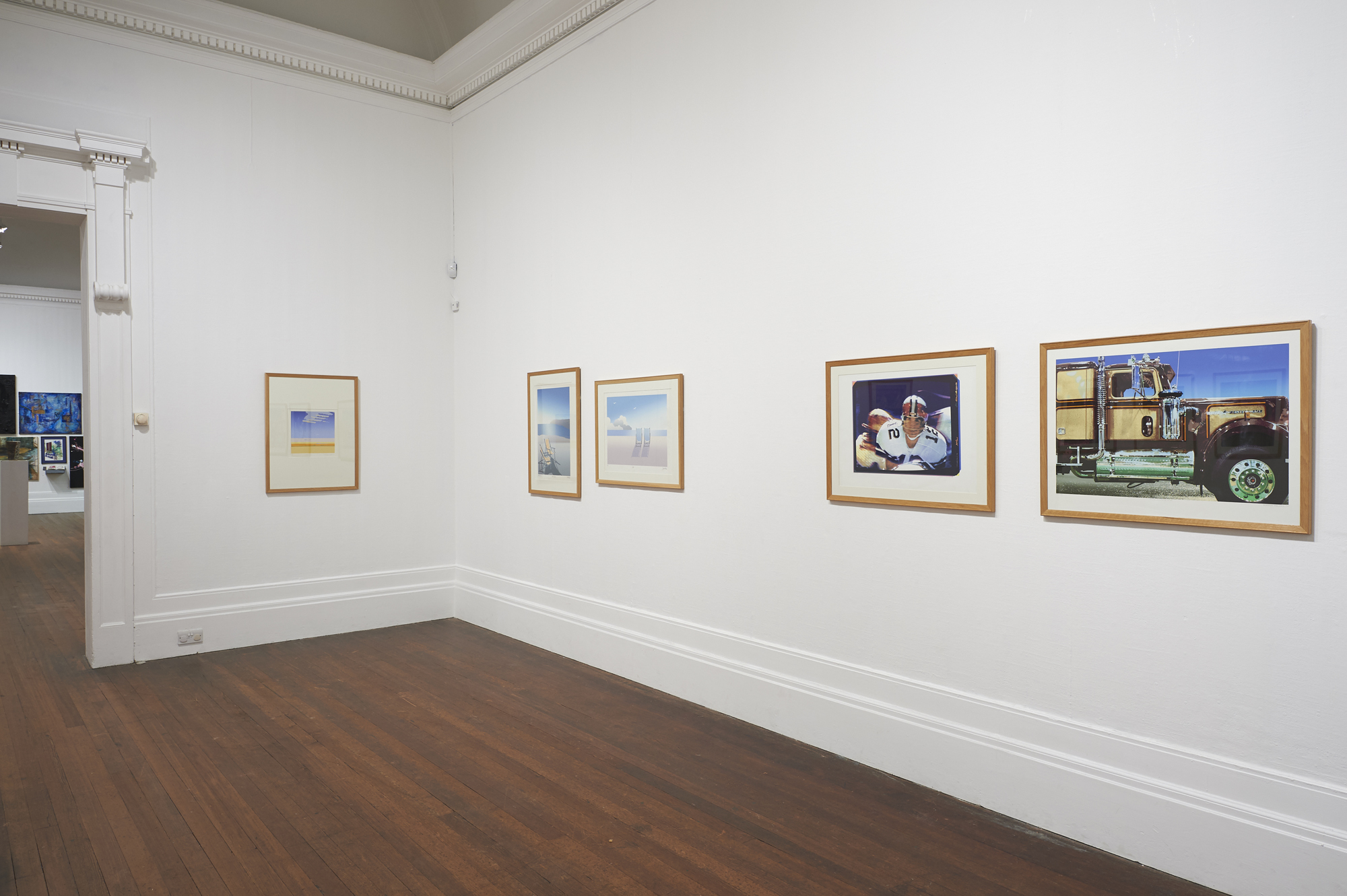 Various printed artworks. The printed artworks included images of American footballers, and chrome decorated truck. The artworks were included in the exhibition Portfolio 1: Prints from The Grundy Collection.