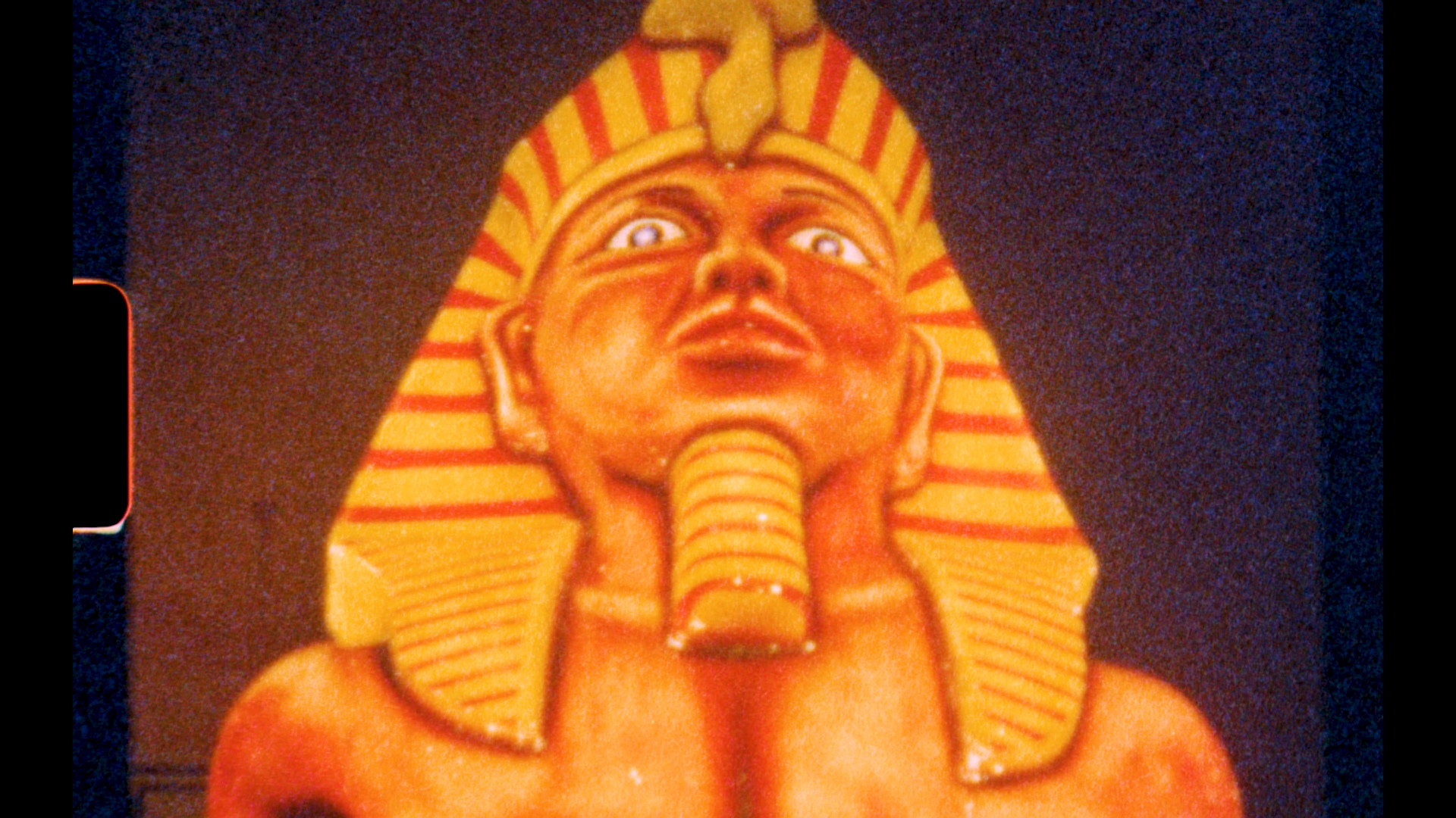 Image of film shown at the gallery from an aliens perspective of the Illuminations and other features of Blackpool's leisure activities. The image shown is an illumination of a Pharaoh.