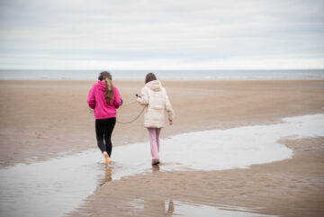 Members of the public with dog face painting on Blackpool's Promanade. Part of the Blackpool Pet Tastic event.